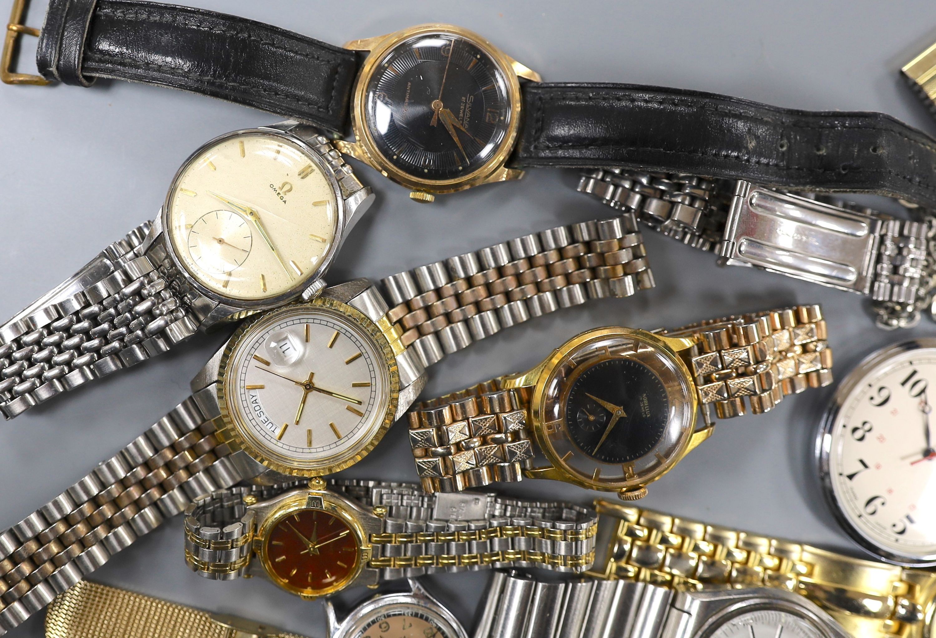 A gentleman's mid 20th century stainless steel Omega manual wrist watch, case diameter 35mm, on associated bracelet, together with eight other assorted wrist watches including Seiko and Silvan, an Oris pocket watch and t